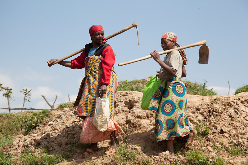 Women till soil in Rwanda